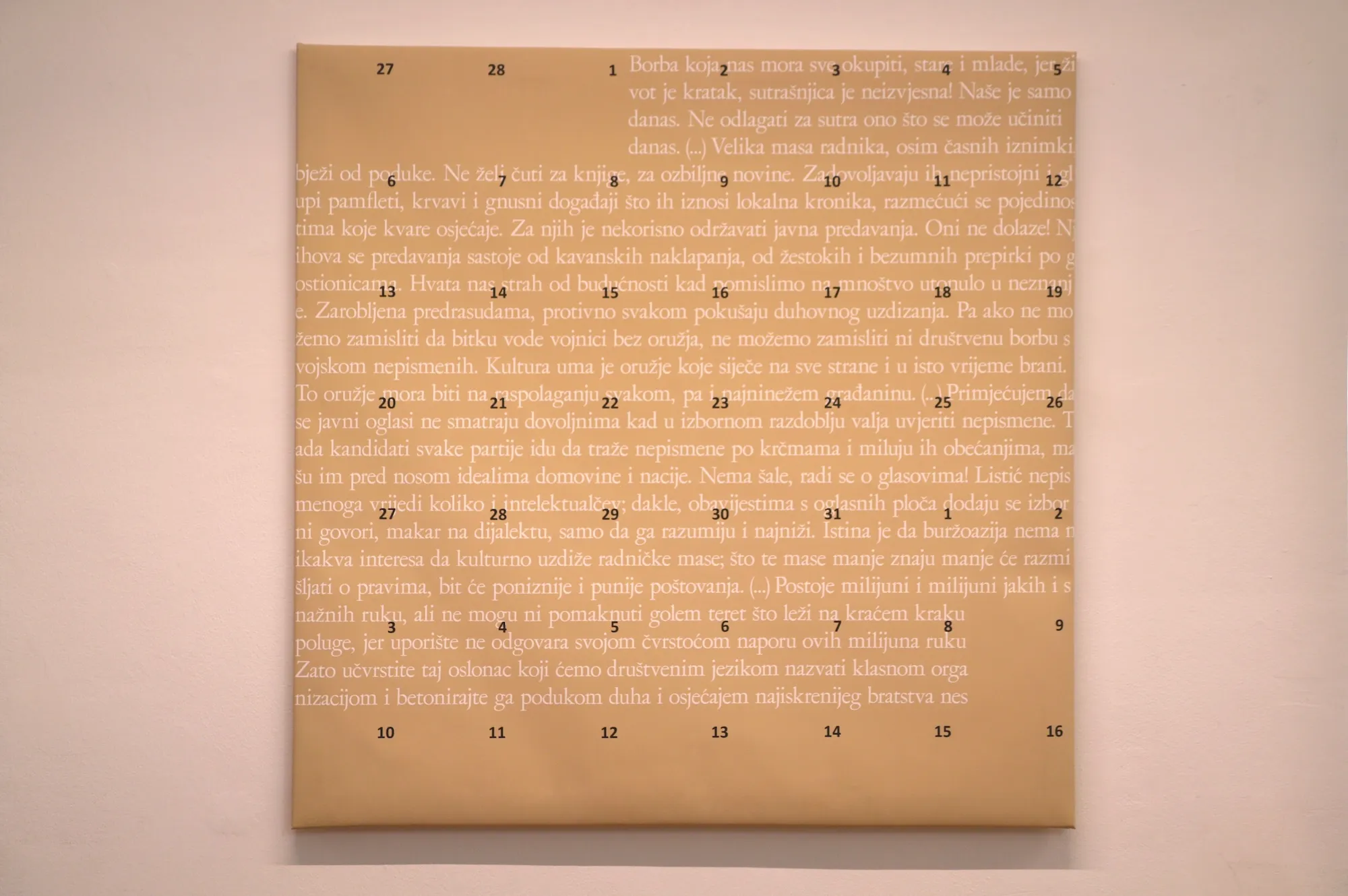 Close-up of the canvas showing text by Giuseppina Martinuzzi overlaid with a grid of calendar day numbers for March and April, unconfined by date boxes.