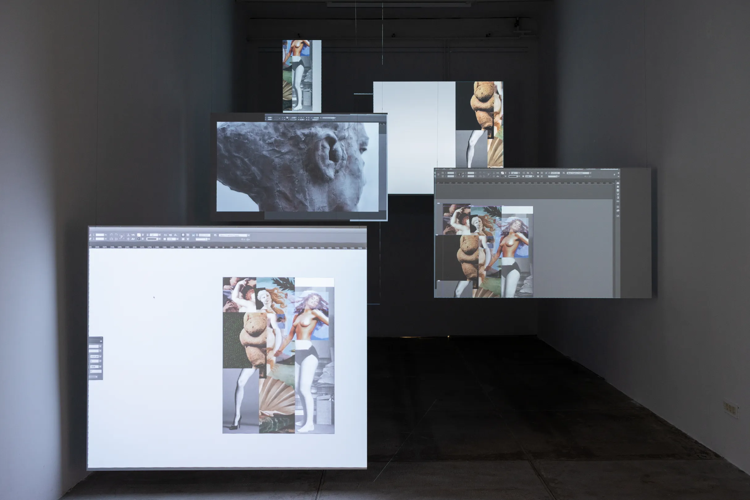 Installation view: multiple suspended screens showing photo-editing software with a collage of classical nude figures and a Renaissance painting, alongside a close-up of a weathered stone bust.