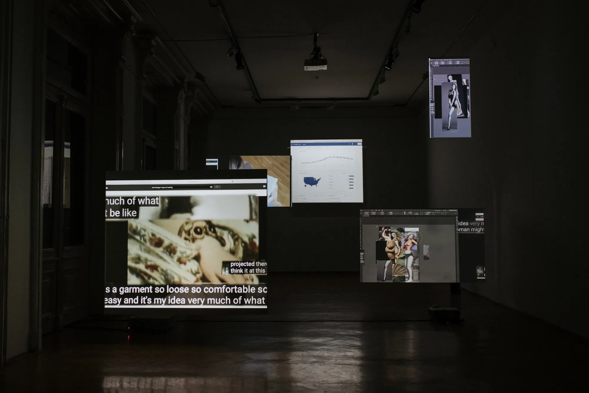 Wide installation view: screens showing a Google Trends chart, a photo collage of classical nude figures, and captioned text, with a smaller screen above showing a fashion photo edit.