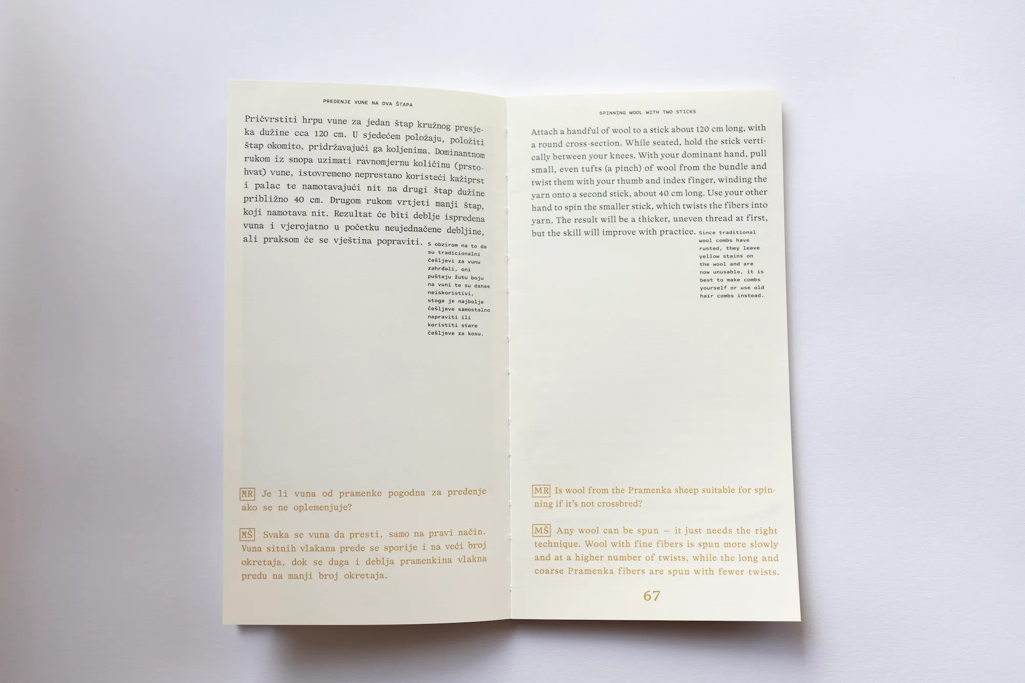 An open spread of the book with bilingual (Croatian and English) instructions for spinning wool with two sticks, alongside a Q&A in the margin.